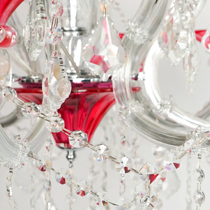 Closeup image of red and clear glass baccarat style chandelier for luxury living room decor styling with polished finish.