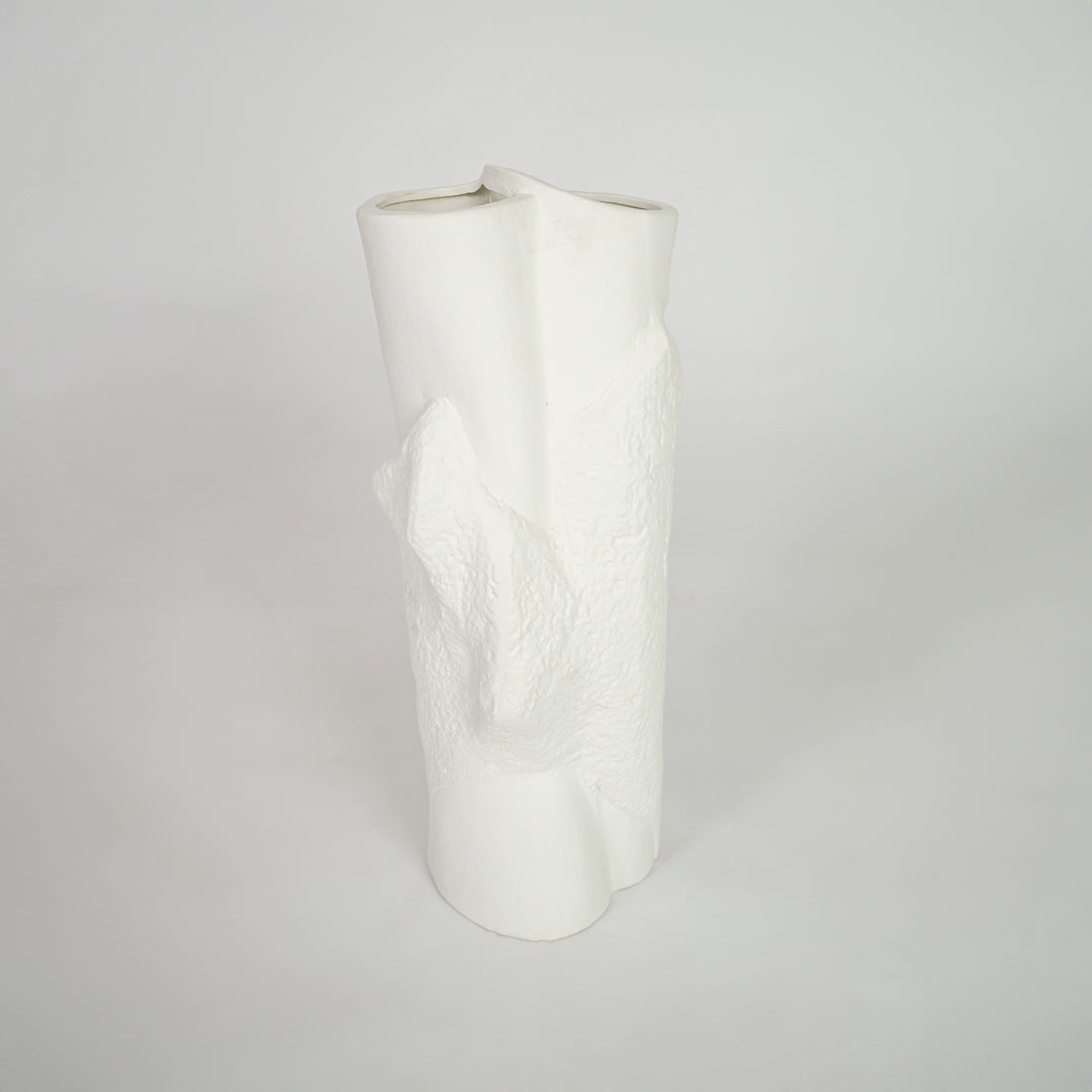 White textured ceramic vase for stylish shelf placement and contemporary living room decor styling statement piece.