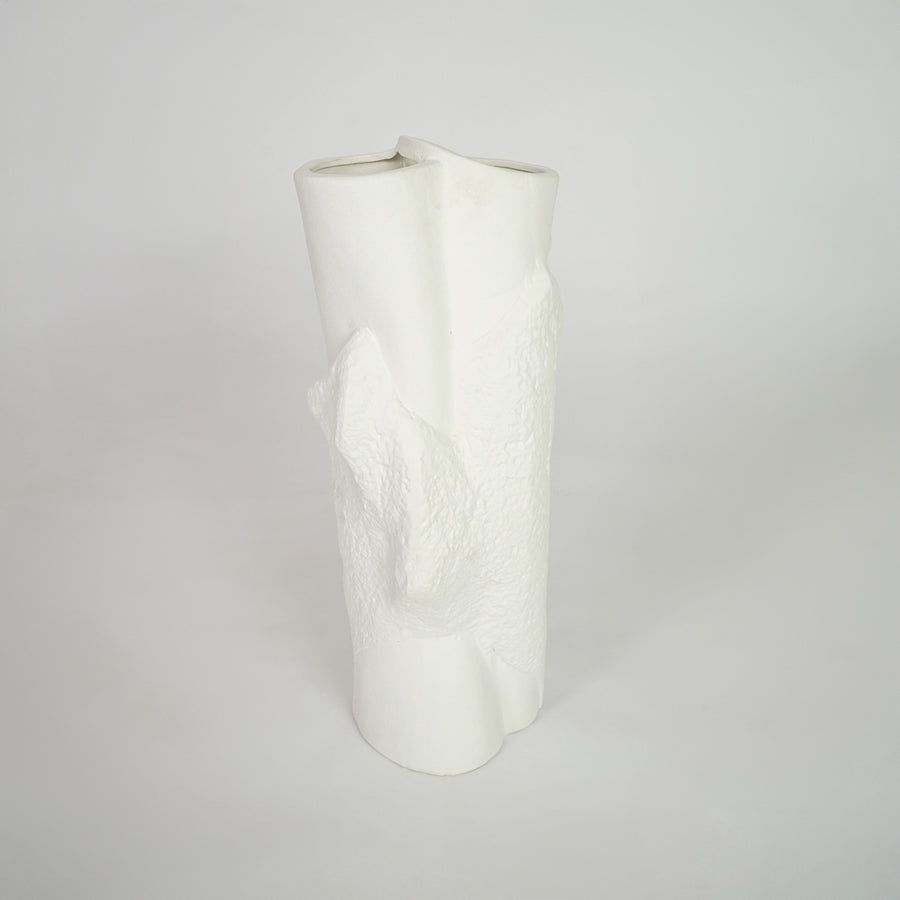 White textured ceramic vase for stylish shelf placement and contemporary living room decor styling statement piece.