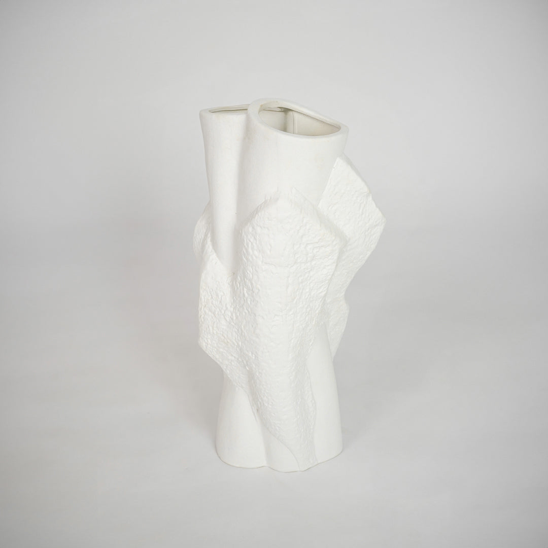 White sculptural ceramic vase for elegant console table placement and modern indoor home decor styling accent piece.