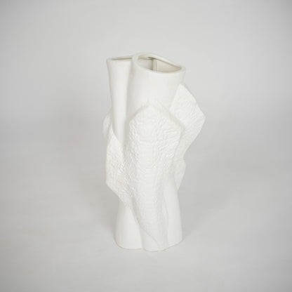 White sculptural ceramic vase for elegant console table placement and modern indoor home decor styling accent piece.