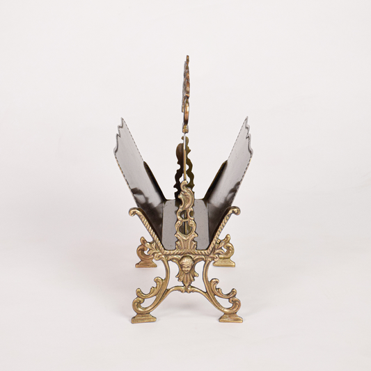 Antique metal napkin holder placed on white background presenting full structure raised sides decorative top handle and sturdy base for tabletop use.