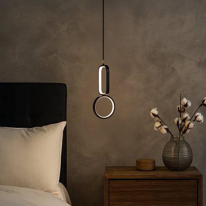 Modern black and white metal dual shape hanging light styled in a minimal room adding soft ambient glow for elegant wall decor.