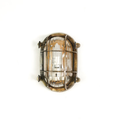 White background image of nautical steampunk bulkhead sconce light fixture for elegant home exterior decor and wall lighting.
