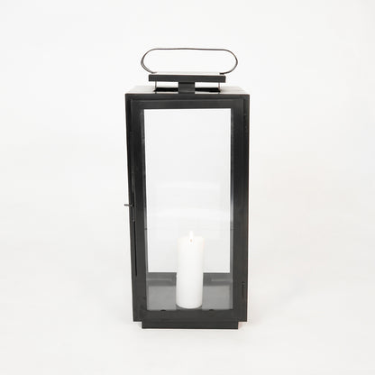 White background image of large metal tower lantern for elegant table decor styling with sleek metallic finish decoration.
