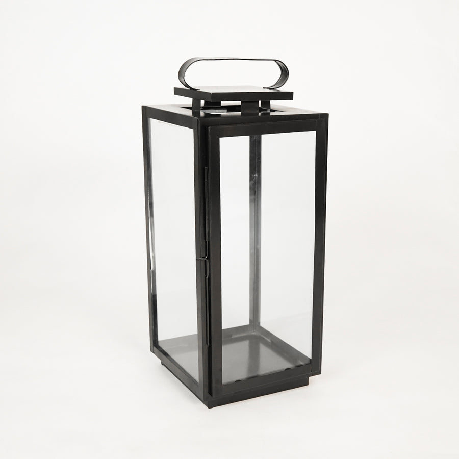 White background image of large metal tower lantern for elegant outdoor decor styling with classic vintage lighting design.