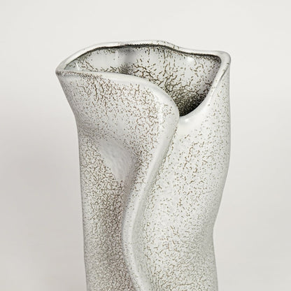 White ceramic decorative vase with textured artistic surface and sculpted wave design perfect for elegant dried floral display.