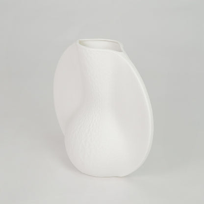 White background image of white ceramic abstract vase for modern tabletop decor styling with matte finish.