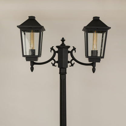 Detailed closeup of black metal lantern head with ribbed glass and classic silhouette ideal for outdoor walkway patio garden and exterior Decor.