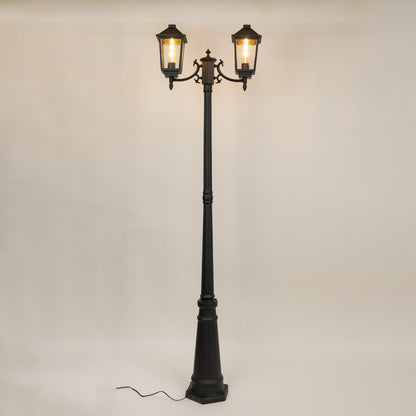 Decorative black outdoor street lamp with warm glowing lanterns for luxury exterior decor use.