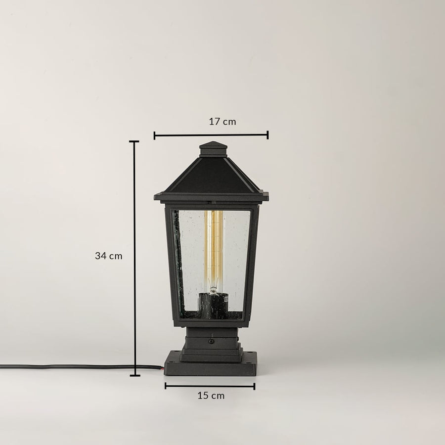 Black outdoor lantern light Dimensions Image 34 cm height by 17 cm top width by 15 cm base width.