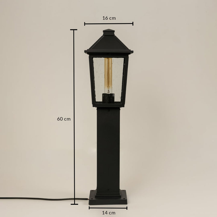 A tall black outdoor post light on a white background showing dimensions clearly marked as 60 cm height 16 cm top width and 14 cm base width.