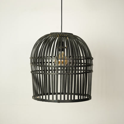 A black metal cage pendant light with a single visible warm-toned bulb inside, hanging against a plain off-white wall.