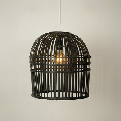 A black metal birdcage pendant light hanging from a black cord against a plain off-white wall, with a glowing warm light bulb visible inside.