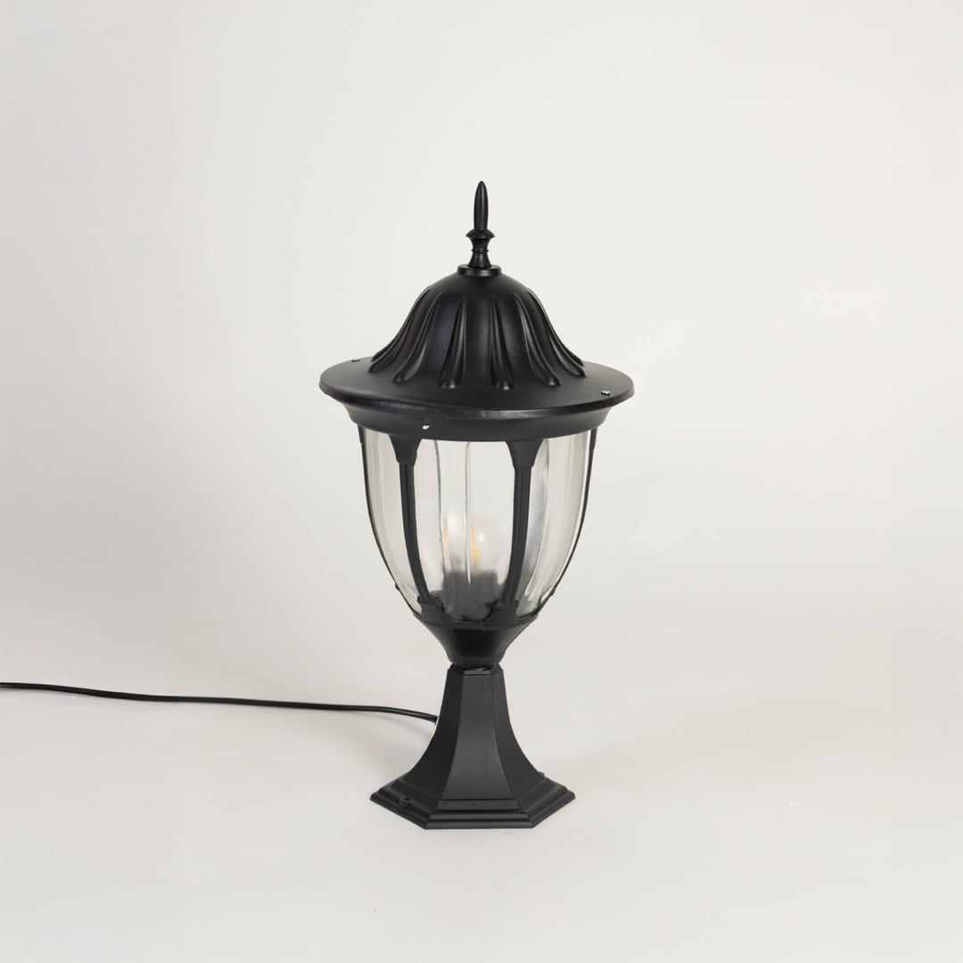 Black outdoor pillar lamp with dome top and clear glass panels designed for villa entrance garden patio and driveway lighting.