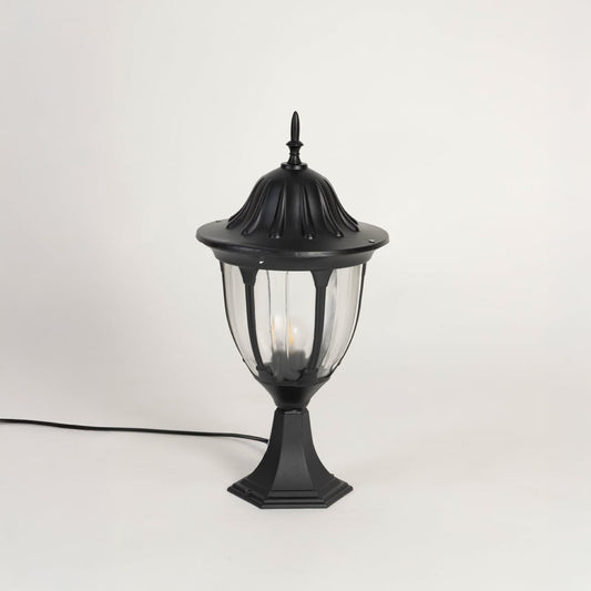 Black outdoor pillar lamp with dome top and clear glass panels designed for villa entrance garden patio and driveway lighting.