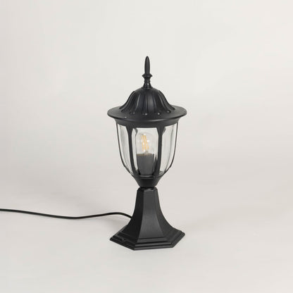 Classic black pillar lamp with clear glass panels shown with light off on white background for garden and gate lighting.