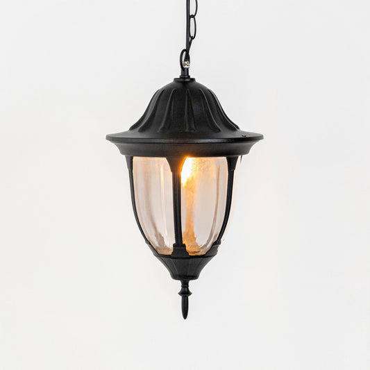 Elegant black metal hanging lantern light with warm glow for modern balcony and patio decor.