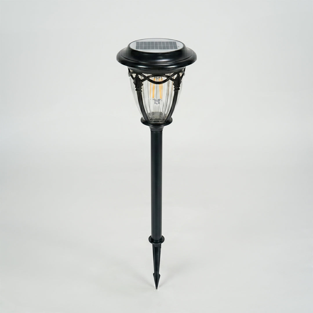 Modern black metal solar pathway light for garden lawn walkway and outdoor lighting on white background image.