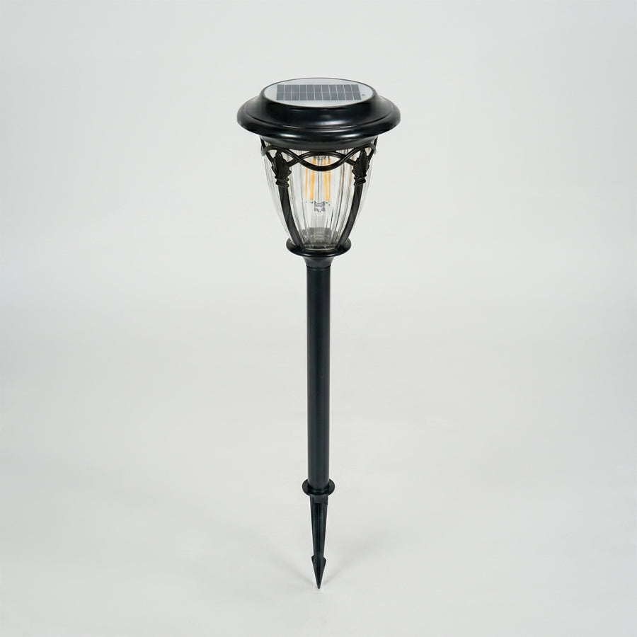 Modern black metal solar pathway light for garden lawn walkway and outdoor lighting on white background image.