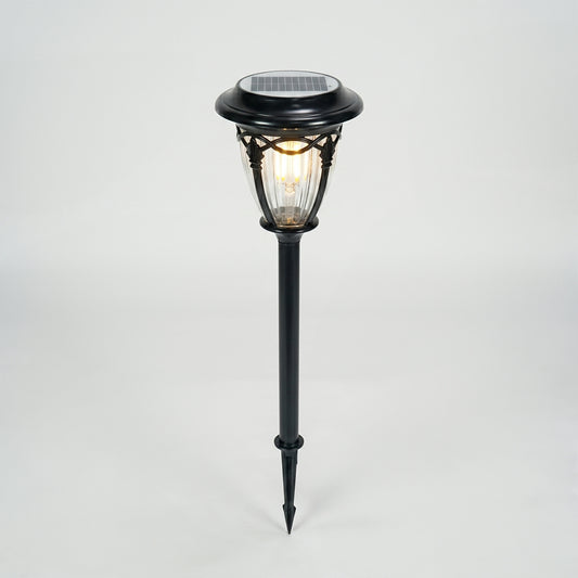 Black metal solar garden pathway light for lawn walkway landscape lighting on white background image.