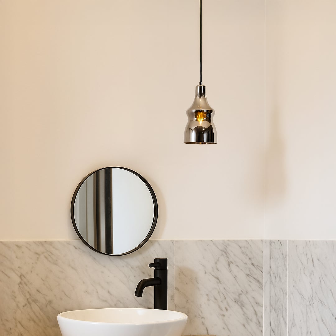 Modern pendant light styled in a warm lifestyle setting showcasing its glossy chrome curved body and elegant hanging design beautifully.