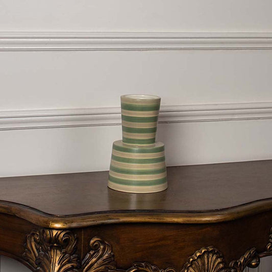 A green and beige striped ceramic vase photographed on a clean white background  showcasing its tapered design and modern handcrafted style.