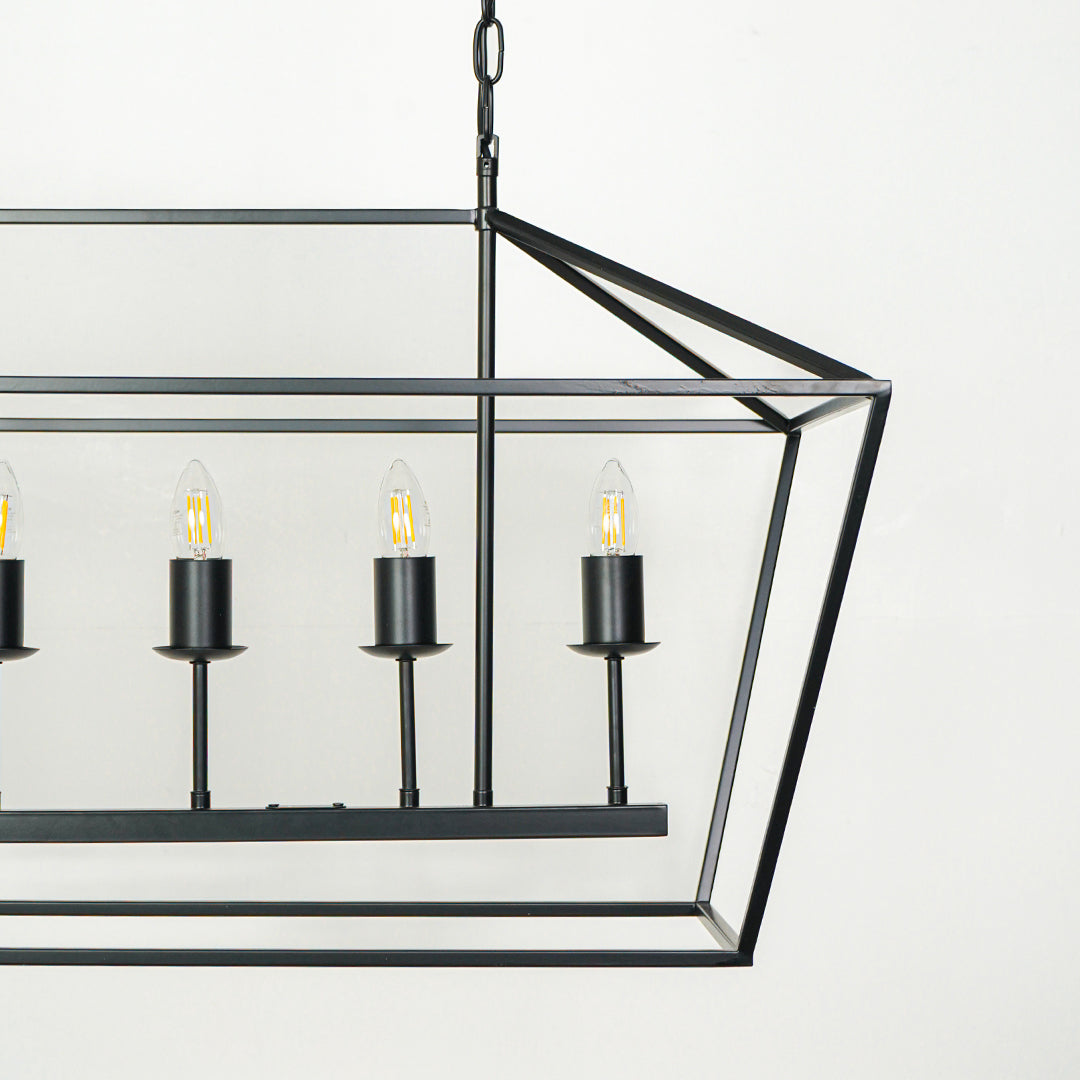 Stylish rectangular metal cage chandelier with multiple bulbs suspended by rods against white wall background ideal for industrial interior lighting.

