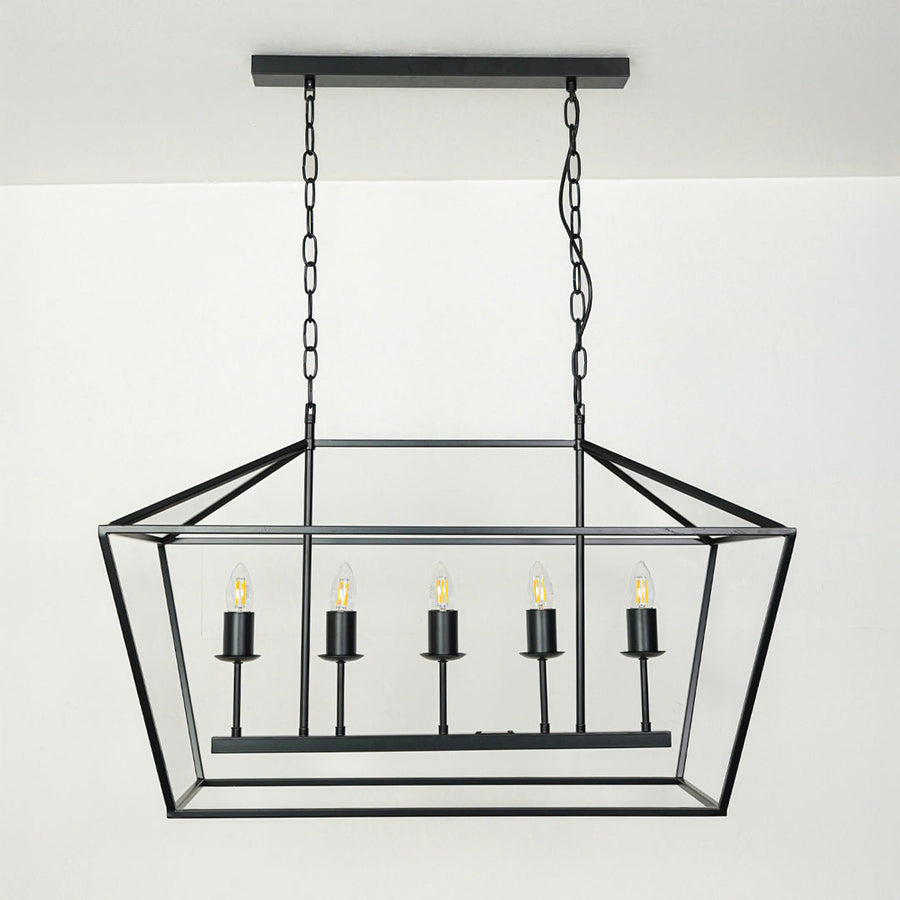 Black metal rectangular chandelier with candle style lights suspended by chain against neutral background ideal for dining table lighting in modern interiors.