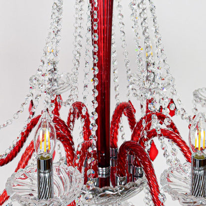Closeup of red and clear crystal chandelier with detailed crystal strands perfect for luxury interior ceiling lighting.