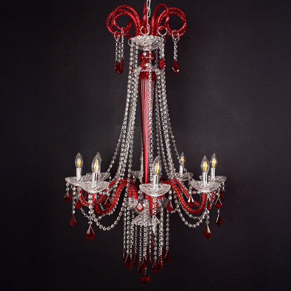 Red and clear crystal chandelier shown on black background highlighting its bold premium ceiling design.