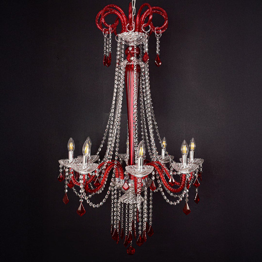 Red and clear crystal chandelier shown on black background highlighting its bold premium ceiling design.