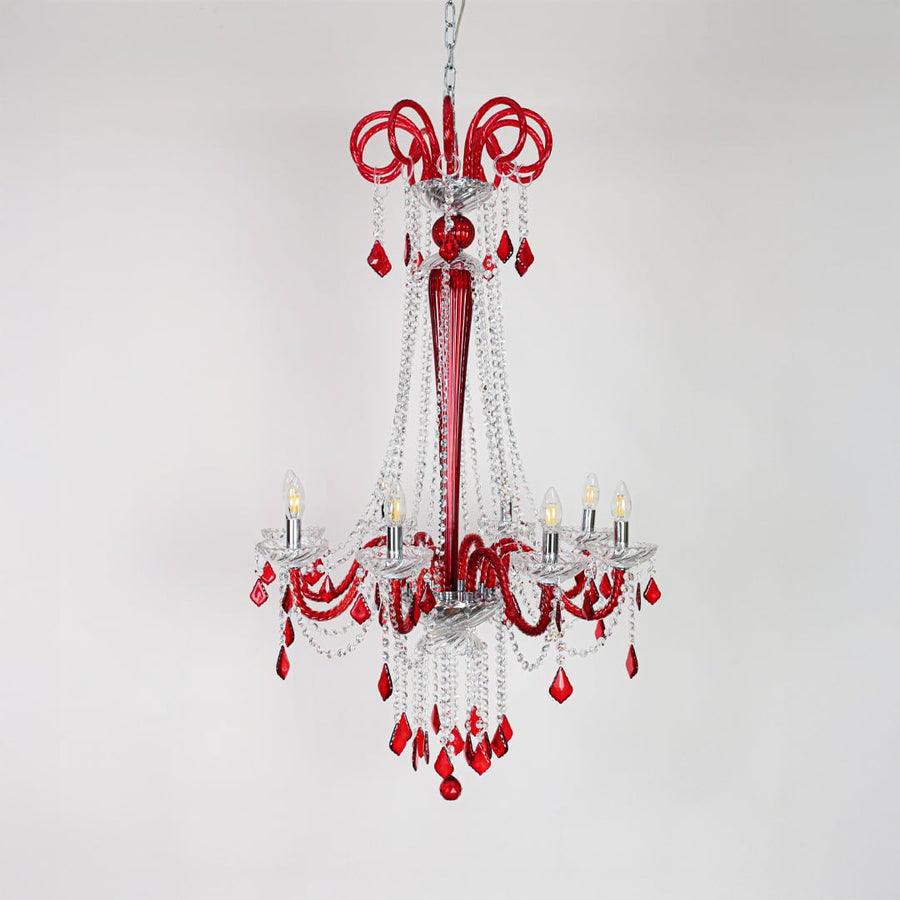 Red and clear crystal chandelier displayed on white background ideal for vibrant elegant interior ceilings.
