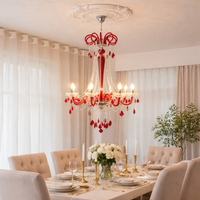 Modern red glass chandelier for dining room living room and contemporary home interiors with decorative lighting.