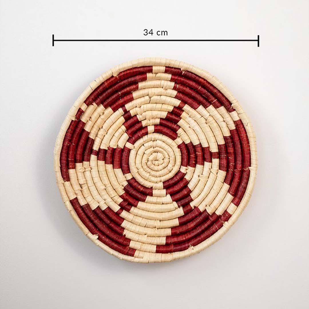 Handwoven woven wall basket decor in natural beige and burgundy with floral pattern and size guide on white background.