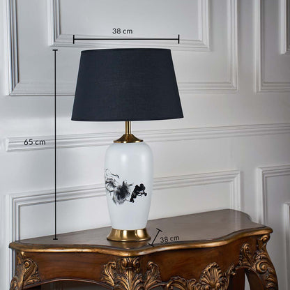 White ceramic table lamp shown with 65 cm height 38 cm shade width and 38 cm base width on a carved wooden console for accurate size reference.