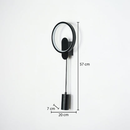 Black wall light with circular frame and hanging cylindrical pendant on neutral wall background 57 cm height 20 cm width 7 cm depth perfect for contemporary interior lighting.