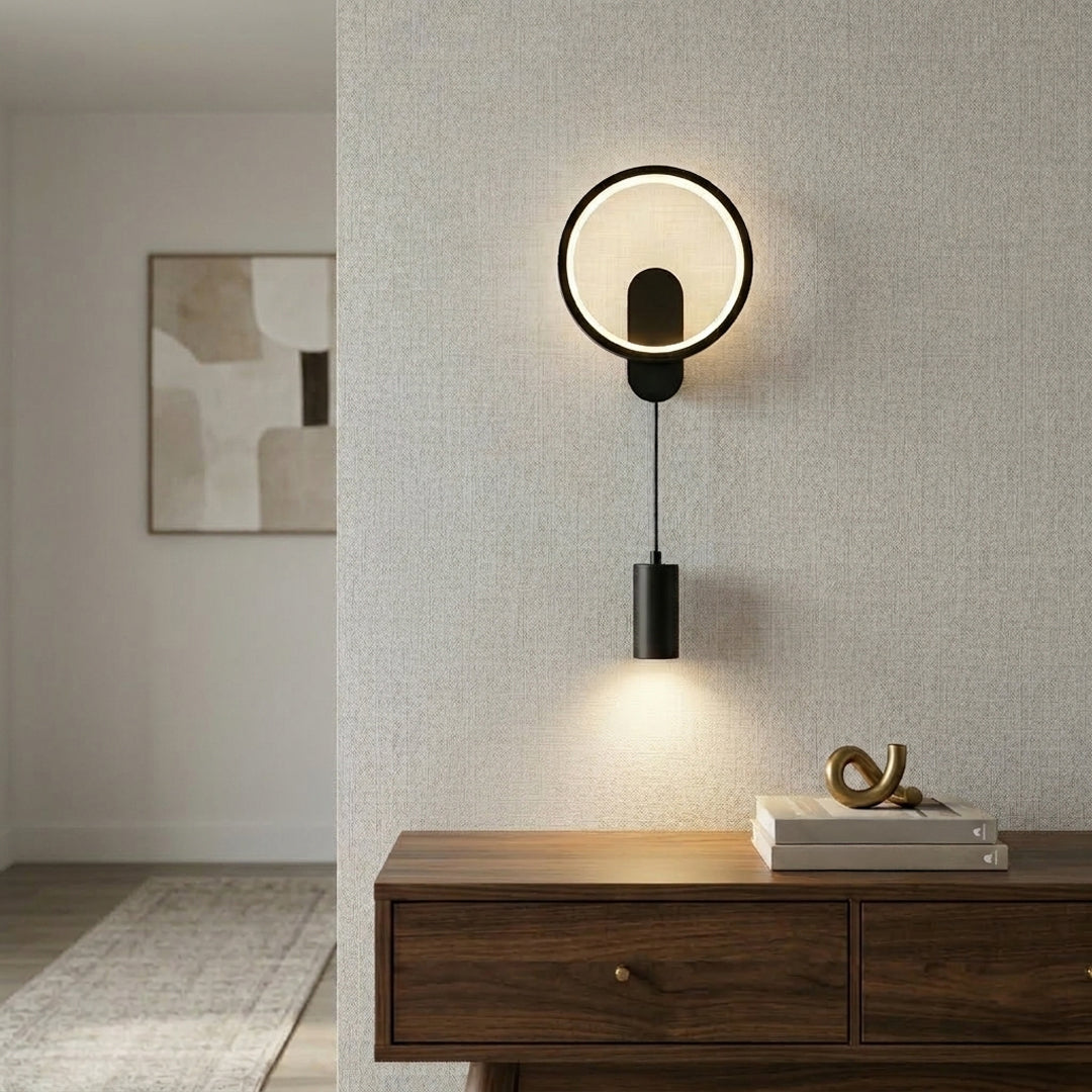 Gold ring wall light installed above wooden console in modern living room with neutral wall background perfect for stylish ambient lighting setup.