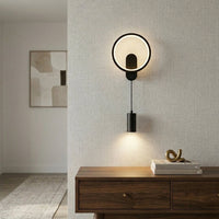 Gold ring wall light installed above wooden console in modern living room with neutral wall background perfect for stylish ambient lighting setup.
