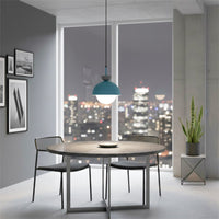 Blue metal pendant light above dining table creating vibrant elegance and modern ambiance indoors.