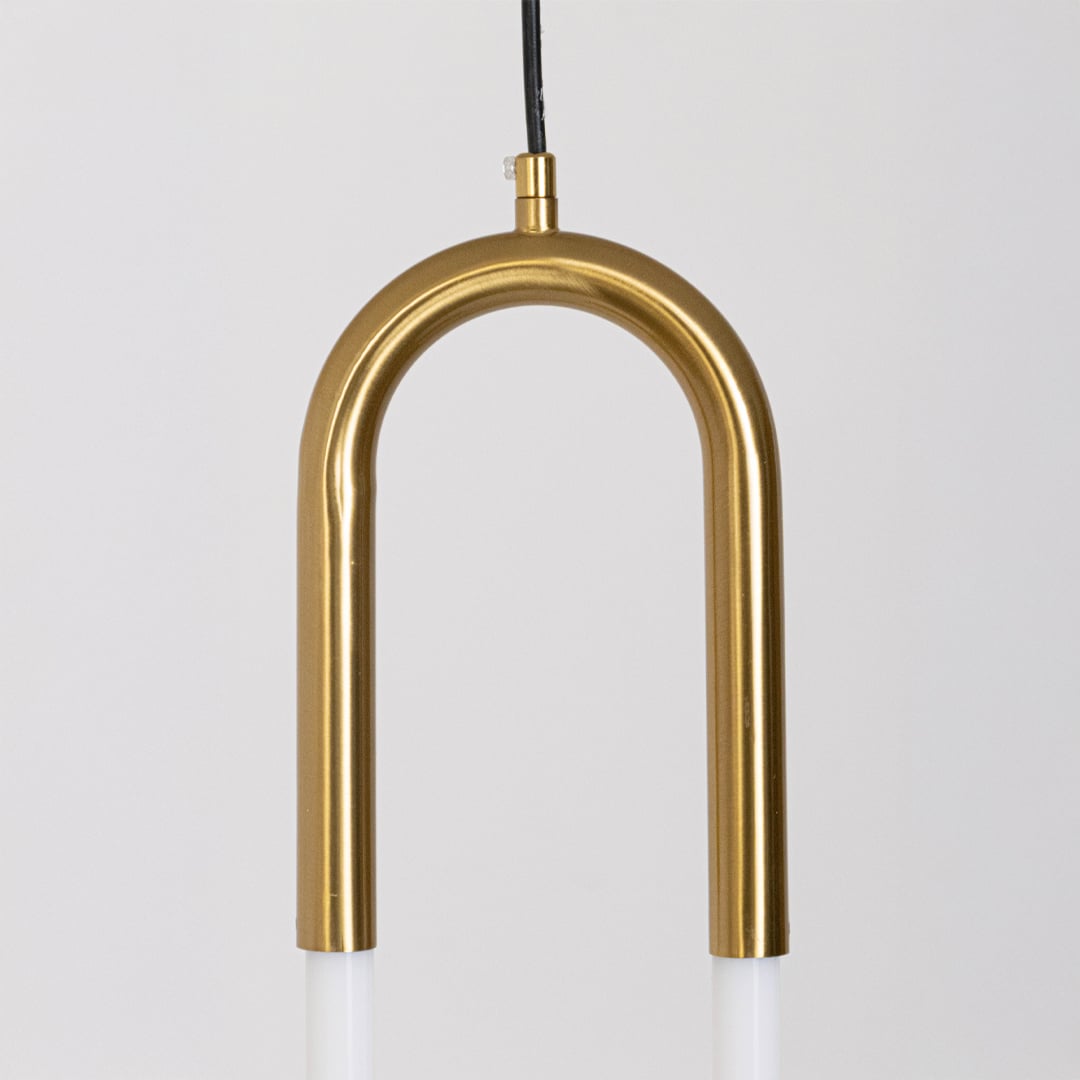 Closeup of gold U shaped pendant light with sleek metal finish highlighting modern craftsmanship and premium LED lighting design.