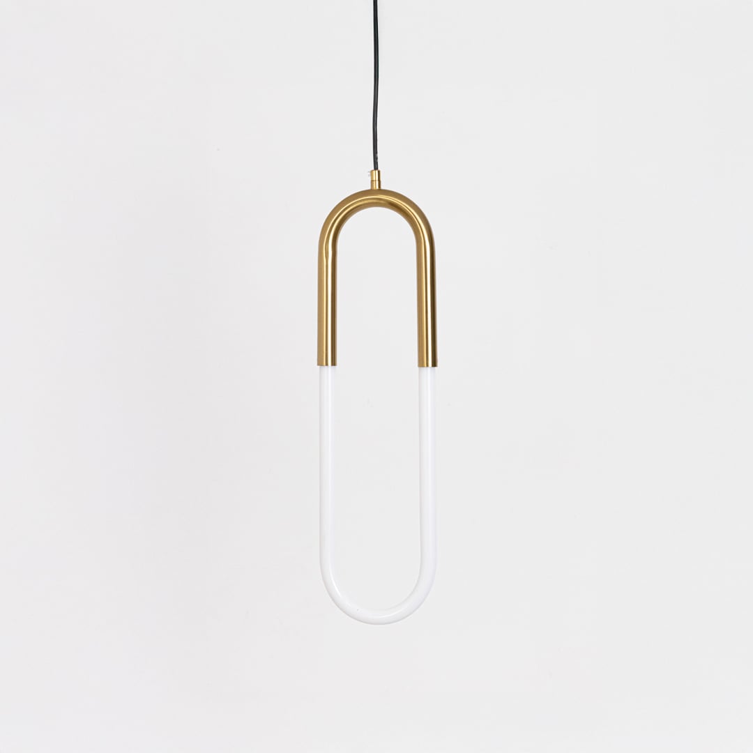 Minimalist gold pendant light with U shaped LED tube switched off displayed on plain white background for stylish catalog display.