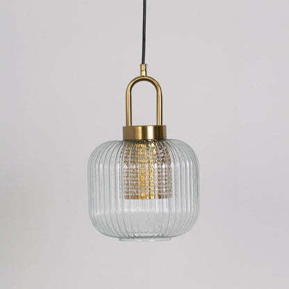 Clear ribbed glass and gold metal pendant light designed for stylish kitchen and dining room decor.