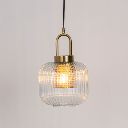 Modern pendant light in gold metal finish with ribbed glass shade for kitchen or dining decor lighting white background.