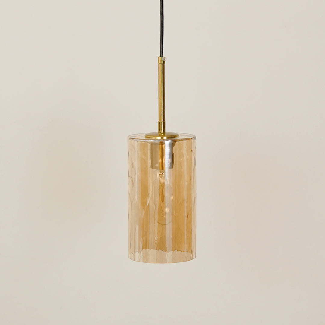 Amber textured glass pendant light with gold fittings for contemporary ceiling placement.