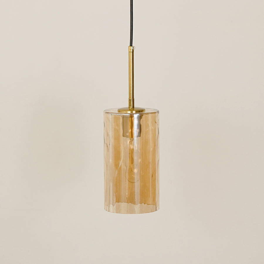 Amber textured glass pendant light with gold fittings for contemporary ceiling placement.