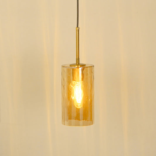 Amber ribbed glass pendant light illuminated warmly for stylish ceiling lighting.