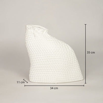 Dimension image of matte white ceramic art vase featuring a textured scaled surface and organic shape showing 35 cm height and 34 cm width.