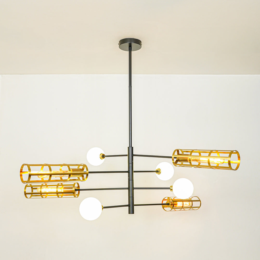 Contemporary chandelier with black metal arms gold cage shades and white globe lights ideal for modern interior decor lighting.