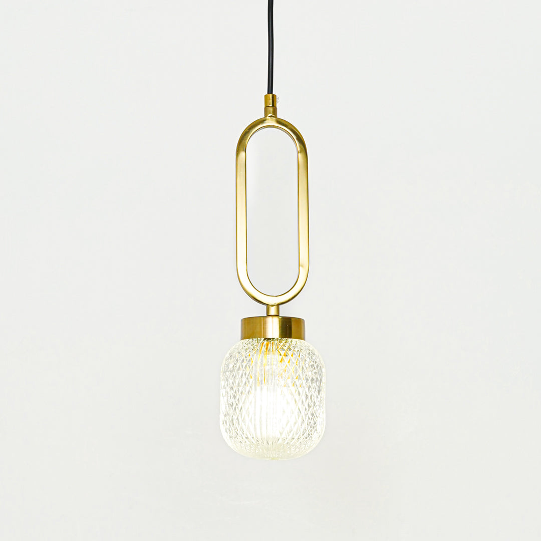 Textured clear glass and gold metal pendant light designed for elegant modern home decor spaces.